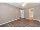 Cozy bedroom with ceiling fan, neutral walls, and access to bathroom and closet at 2022 Patterson Park Dr, Lawrenceville, GA 30044