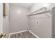 Laundry room with wood look floors, washer hookups, and storage shelving at 2022 Patterson Park Dr, Lawrenceville, GA 30044