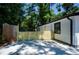 Property highlighting a concrete patio for outdoor enjoyment, framed by a wooden fence for added privacy at 4244 Lindsey Dr, Decatur, GA 30035