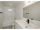 Bright bathroom with modern vanity, quartz countertop, sleek black faucet, and shower/tub combo at 4244 Lindsey Dr, Decatur, GA 30035
