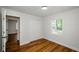 Inviting bedroom features wood-look flooring, a window, and closet for ample storage at 4244 Lindsey Dr, Decatur, GA 30035