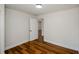 Comfortable bedroom features wood-look floors, white trim and an open doorway at 4244 Lindsey Dr, Decatur, GA 30035