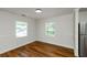 Inviting dining area with hardwood floors, natural light, and fresh paint adjacent to a modern kitchen at 4244 Lindsey Dr, Decatur, GA 30035