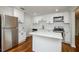 Stylish kitchen with white cabinets, stainless steel appliances, a center island, and elegant subway tile backsplash at 4244 Lindsey Dr, Decatur, GA 30035