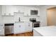 Bright kitchen features white cabinets, stainless steel appliances, marble countertops, and subway tile backsplash at 4244 Lindsey Dr, Decatur, GA 30035