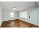 Bright living room showcasing hardwood floors, fresh paint, new windows, and a stylish front door at 4244 Lindsey Dr, Decatur, GA 30035