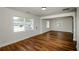 Open-concept living room with refinished hardwood floors, neutral paint, and abundant natural light from updated windows at 4244 Lindsey Dr, Decatur, GA 30035