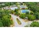 Aerial view of community amenities including pool, tennis courts, clubhouse, and green spaces at 4327 Azalea Ridge Way, Hoschton, GA 30548
