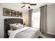 Cozy bedroom featuring a plush bed, neutral decor, and a bright window at 4327 Azalea Ridge Way, Hoschton, GA 30548
