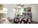 This bedroom is well-lit and decorated with stylish furniture, decor, and has large windows at 4327 Azalea Ridge Way, Hoschton, GA 30548