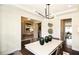 Elegant dining area offering views of the foyer, kitchen and sitting area with refined decor at 4327 Azalea Ridge Way, Hoschton, GA 30548