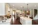 Gourmet kitchen with large island, stainless steel appliances, and stylish pendant lighting at 4327 Azalea Ridge Way, Hoschton, GA 30548