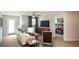 Comfortable living room with stylish furnishings and view into the bedroom at 4327 Azalea Ridge Way, Hoschton, GA 30548