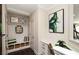 Well-organized mudroom with storage bench and desk area featuring stylish decor and useful organizers at 4327 Azalea Ridge Way, Hoschton, GA 30548