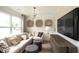 Stylish sitting room features a comfortable sectional sofa and flat screen tv at 4327 Azalea Ridge Way, Hoschton, GA 30548