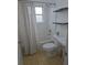 Bathroom featuring tiled floor, shower and tub combo, and built-in shelving at 48 Peachtree Ne Ave # 321, Atlanta, GA 30305