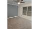 Spacious bedroom with neutral carpet, a ceiling fan, and a large window at 48 Peachtree Ne Ave # 321, Atlanta, GA 30305