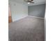 Bedroom features plush carpeting, a ceiling fan, and a combination of gray and white walls at 48 Peachtree Ne Ave # 321, Atlanta, GA 30305