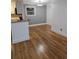 Dining area features hardwood floors and access to a kitchen bar with granite countertops at 48 Peachtree Ne Ave # 321, Atlanta, GA 30305