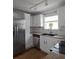 Bright kitchen features stainless steel appliances, white cabinets, and granite countertops at 48 Peachtree Ne Ave # 321, Atlanta, GA 30305