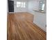 Living room features hardwood flooring, bright windows, and a granite countertop accent at 48 Peachtree Ne Ave # 321, Atlanta, GA 30305