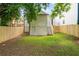 Fenced backyard with green grass, access stairs, and a back door to the home at 995 Lena Nw St, Atlanta, GA 30314