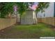 Enhanced backyard featuring green grass, access stairs, and a back door to the home at 995 Lena Nw St, Atlanta, GA 30314