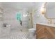 Elegant bathroom featuring a glass shower, marble accents, stylish fixtures, and modern vanity at 995 Lena Nw St, Atlanta, GA 30314