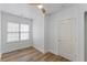 Bright bedroom with a ceiling fan, window, and a closed closet door at 995 Lena Nw St, Atlanta, GA 30314