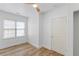 Compact bedroom with a ceiling fan, window, and a closed closet door at 995 Lena Nw St, Atlanta, GA 30314
