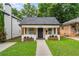 Charming single-story home with a welcoming front porch, planter boxes, and a well-manicured lawn at 995 Lena Nw St, Atlanta, GA 30314