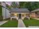 Charming single-story home with a welcoming front porch, planter boxes, and a well-manicured lawn at 995 Lena Nw St, Atlanta, GA 30314