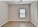 Bedroom with a ceiling fan, neutral walls, and a window offering natural light at 2090 Harvester Ln, Buford, GA 30518