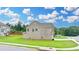 A lovely exterior view of a brick home with well-maintained landscaping and a lush green lawn at 2090 Harvester Ln, Buford, GA 30518