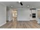 Open-concept living room showcasing wood-look flooring and neutral paint, perfect for modern living at 2090 Harvester Ln, Buford, GA 30518