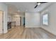 Bright and open living room features wood-look floors, recessed lights, and natural light at 2090 Harvester Ln, Buford, GA 30518