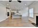 Open floor plan featuring a gourmet kitchen with stainless appliances and adjacent living room at 2090 Harvester Ln, Buford, GA 30518