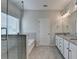 Main bathroom features a walk-in shower, tub, and double vanity at 2090 Harvester Ln, Buford, GA 30518