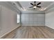 Main bedroom with trey ceiling, ceiling fan, and decorative wall trim at 2090 Harvester Ln, Buford, GA 30518