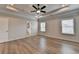 Spacious main bedroom with tray ceilings, recessed lighting, a ceiling fan, wood floors and an ensuite at 2090 Harvester Ln, Buford, GA 30518