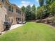 Wide shot of a spacious backyard featuring a patio and ample space for outdoor activities at 3315 High Noontide Nw Way, Acworth, GA 30101