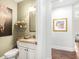 Elegant powder room with granite countertop, vessel sink, and stylish decor at 3315 High Noontide Nw Way, Acworth, GA 30101