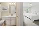 Bright bathroom with a spacious vanity and a doorway leading to a bedroom with natural light at 3315 High Noontide Nw Way, Acworth, GA 30101