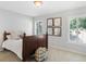 Bedroom featuring plantation shutters, a decorative basket, and coordinated artwork at 3315 High Noontide Nw Way, Acworth, GA 30101