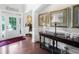 Welcoming foyer featuring hardwood floors, decorative console table, and elegant wall decor at 3315 High Noontide Nw Way, Acworth, GA 30101