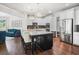 Bright, open kitchen featuring stainless steel appliances, granite countertops, and a large center island at 3315 High Noontide Nw Way, Acworth, GA 30101