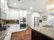 Modern kitchen featuring stainless steel appliances, granite countertops, and hardwood floors at 3315 High Noontide Nw Way, Acworth, GA 30101