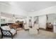 Open-concept living space with a kitchen island, dining table, and a seating area with light-colored furniture at 3315 High Noontide Nw Way, Acworth, GA 30101