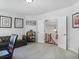 Open living room with an open staircase, a leather sofa, and natural light at 3315 High Noontide Nw Way, Acworth, GA 30101