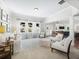 Spacious living room with white seating, patterned rug, and abundant natural light from large windows at 3315 High Noontide Nw Way, Acworth, GA 30101